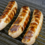 Deliciously cooked kielbasa on a serving board