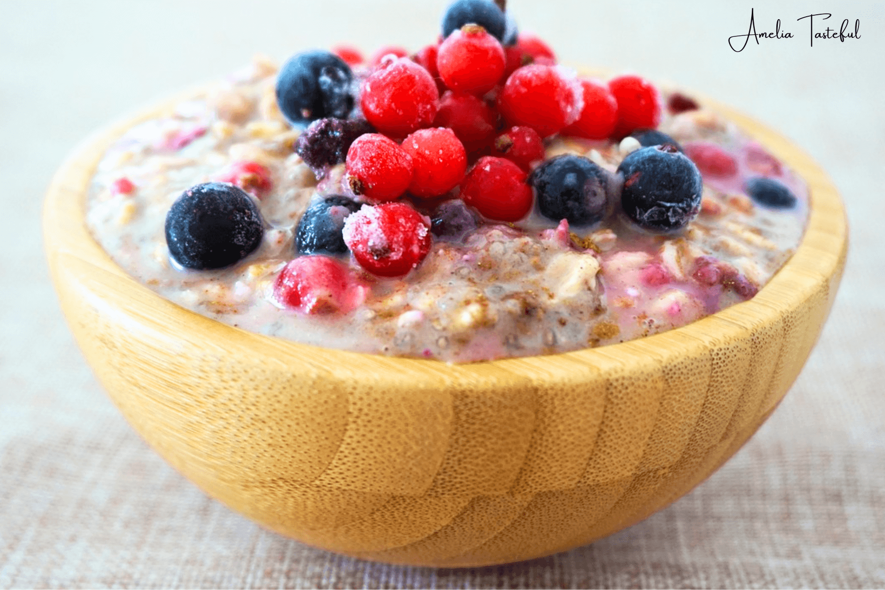 Heated overnight oats in a bowl with fresh toppings