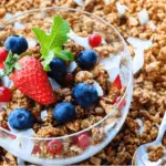 Delicious bowl of heated overnight oats with apple and cinnamon toppings