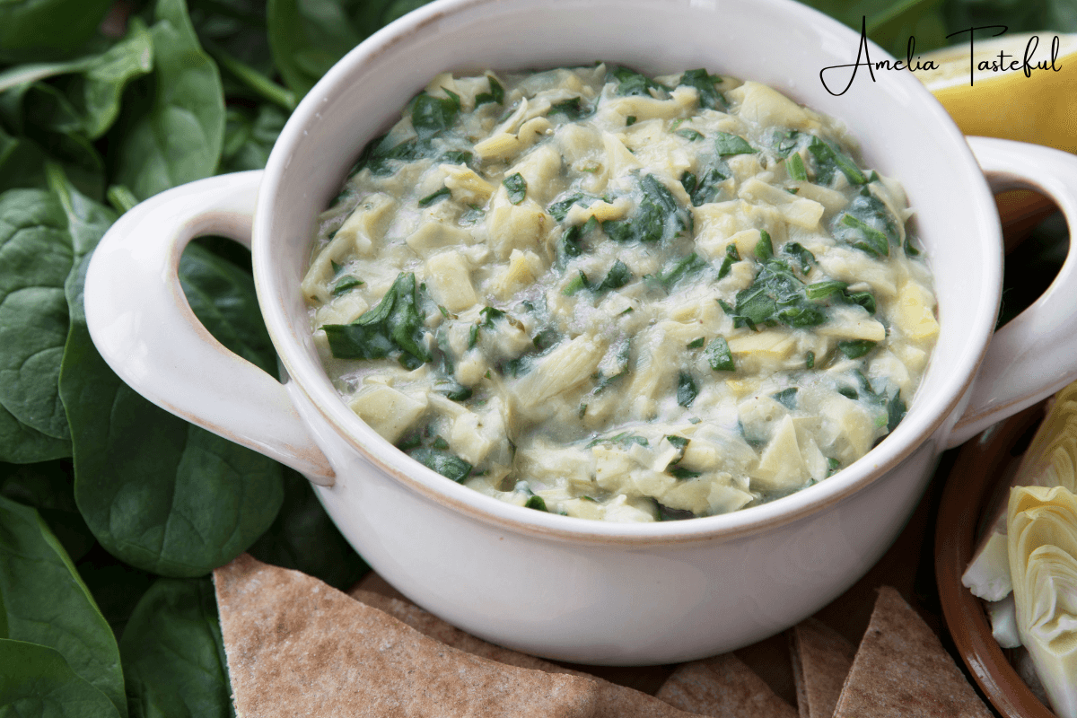 Spinach dip served with a variety of healthy dipping options.