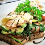 Delicious Poached Egg over Creamy Avocado on Toast